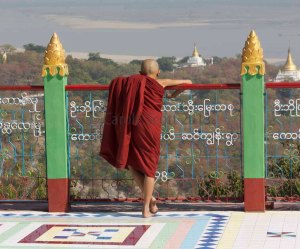 A monk enjoys the view © Carole Scott 2013